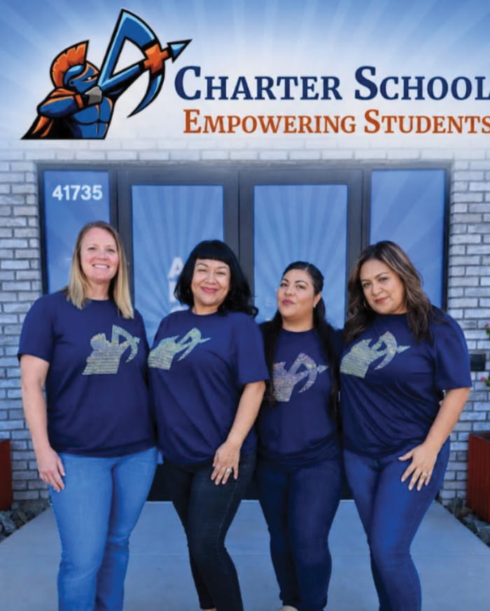 Four ladies in front of A+ Charter Schools entrance