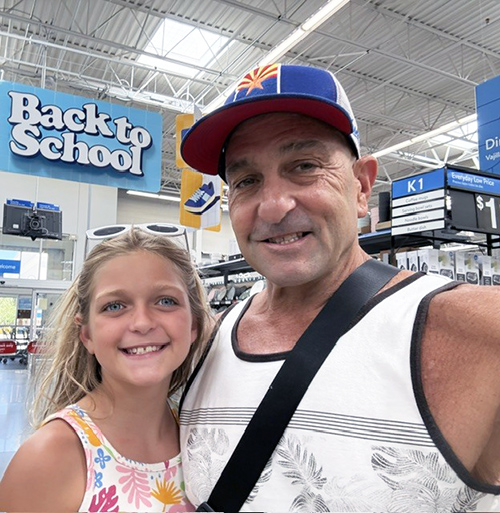 Dr. Dave Dumon, Superintendent, with his daughter
