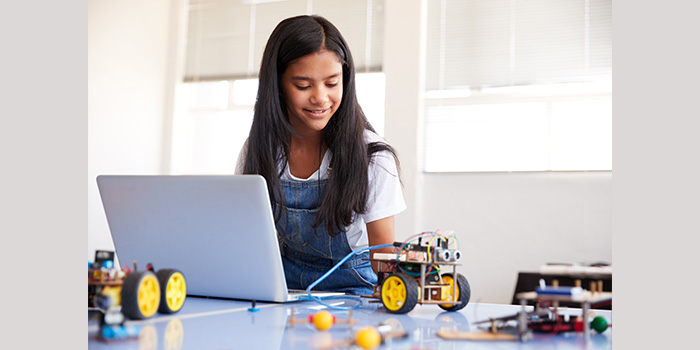 Student building a robot