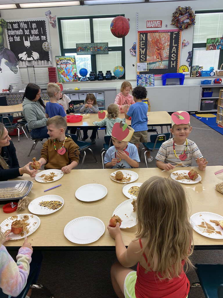 Kindergarten students enjoying Johnny Appleseed Day