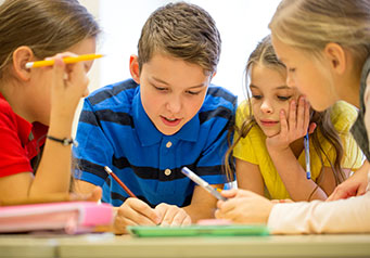 Students working together on an assignment at a table
